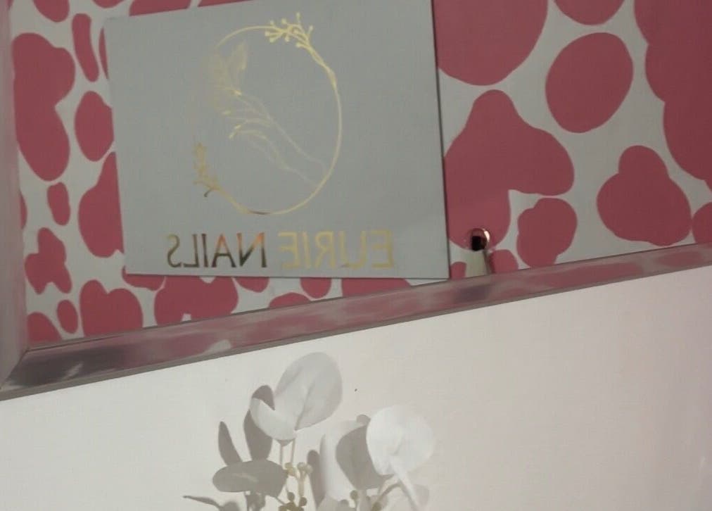 Elegant Eurie Nails wall decor at Randburg, Gauteng, ZA with floral accents.