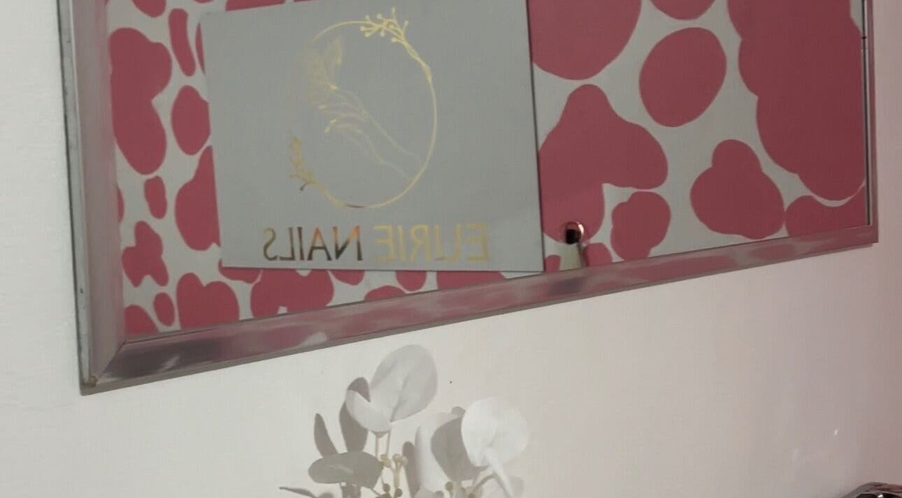Elegant Eurie Nails wall decor at Randburg, Gauteng, ZA with floral accents.