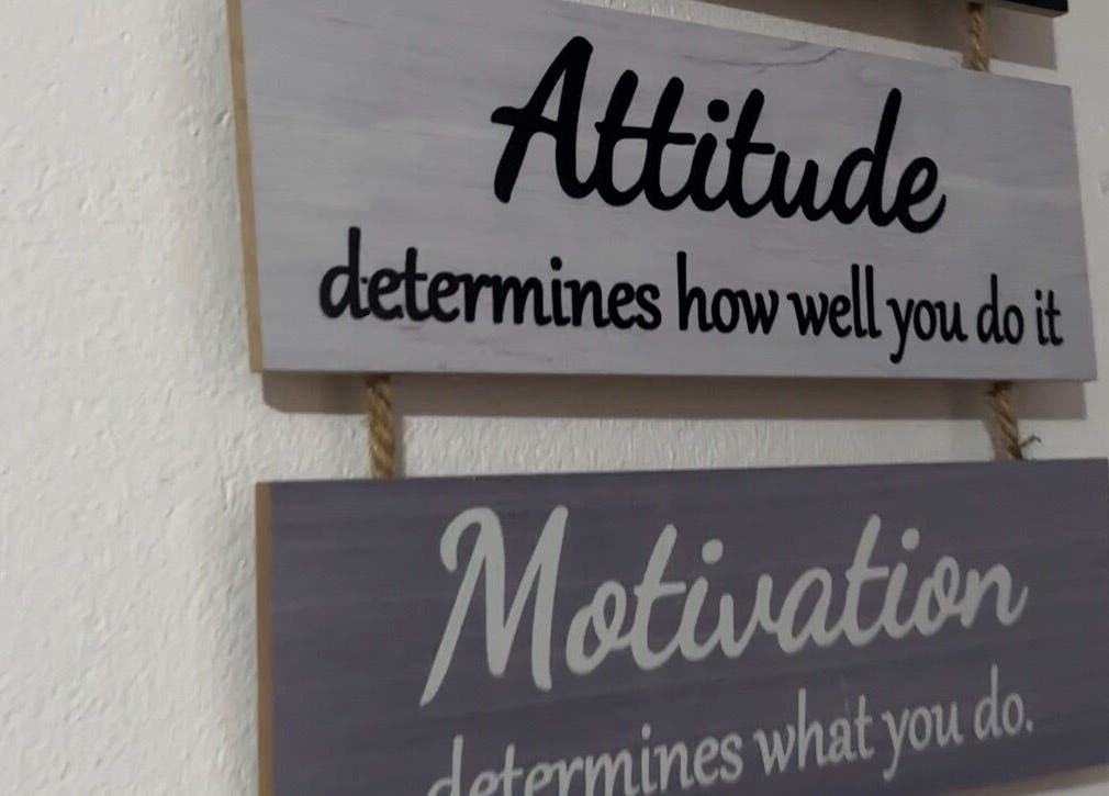 Inspirational wall decor at Eurie Nails in Randburg, Gauteng, ZA, highlighting attitude and motivation quotes.