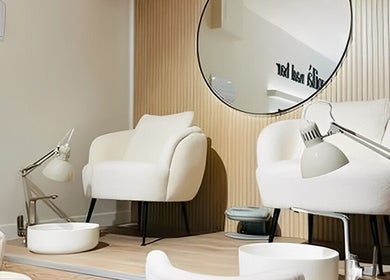 Relaxing pedicure area at Voila Nails Beauty Madrid, Madrid, Comunidad De Madrid, ES with plush chairs.
