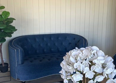 Elegant lounge at Spa Bekam Ar Rayyan Nilai, Bandar Baru Nilai, Negeri Sembilan, MY with blue sofa and white orchids.