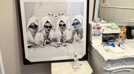 Framed picture of women in robes at Etonne Clinic, New York, New York, US, showcasing spa relaxation.