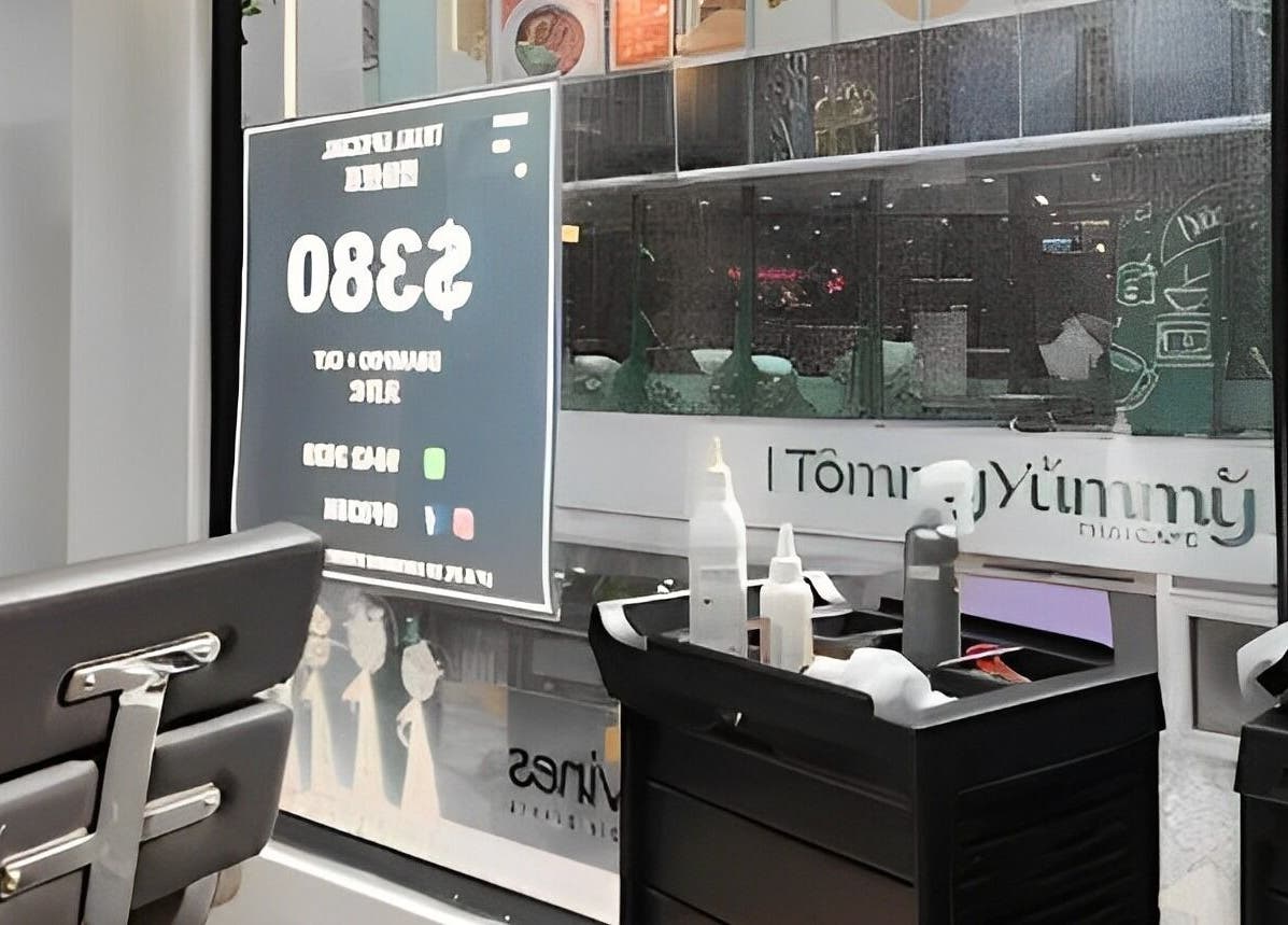 Cozy interior at French83 salon, Hong Kong Island, showcasing sleek chairs and grooming tools.