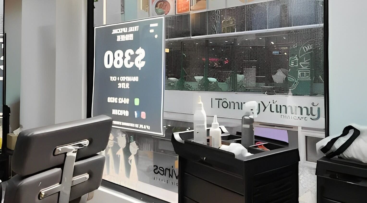 Cozy interior at French83 salon, Hong Kong Island, showcasing sleek chairs and grooming tools.