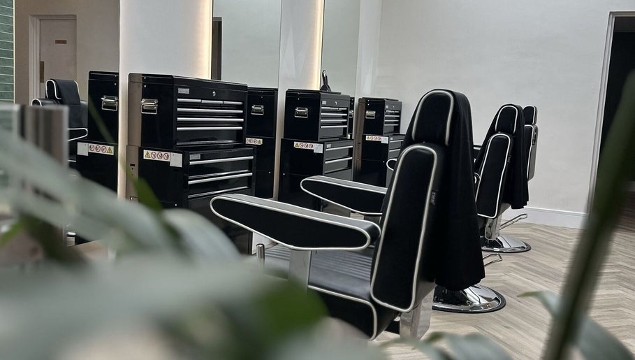 Modern barber chairs at INFINITE Gents Grooming, Glasgow, Scotland, GB, showcasing a stylish, sleek interior.