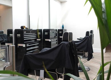 INFINITE Gents Grooming's sleek barber stations in Glasgow, Scotland, GB ready for clients.