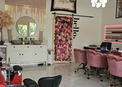 Interior of Nikki D Nails Beauty Aesthetics, Chadwell St Mary, featuring chic decor and floral accents.