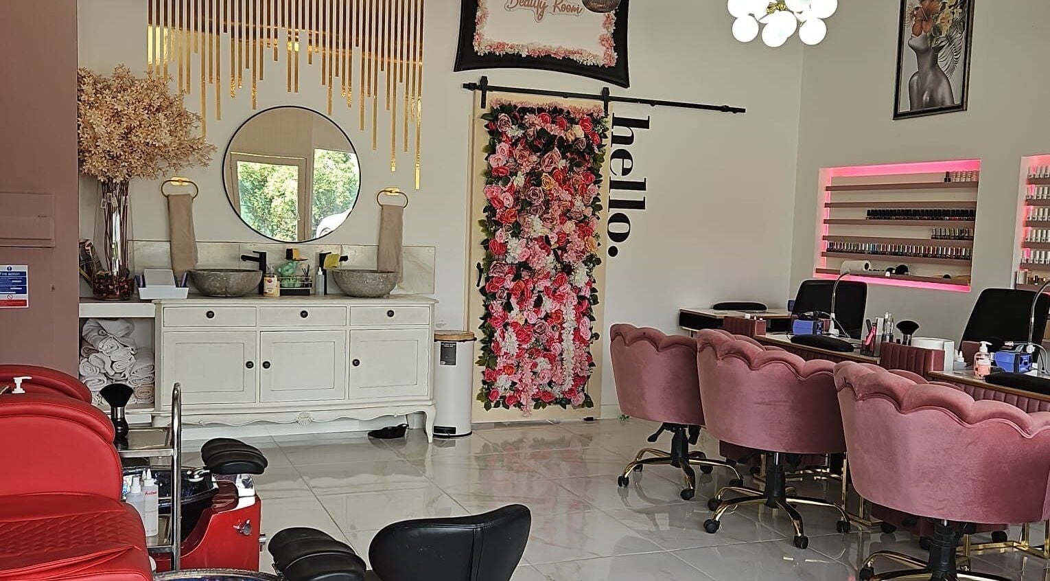 Interior of Nikki D Nails Beauty Aesthetics, Chadwell St Mary, featuring chic decor and floral accents.