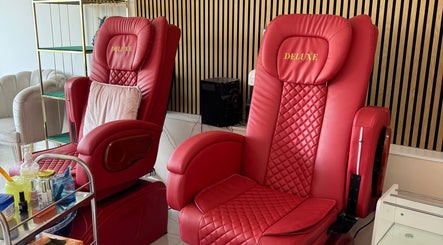 Deluxe red pedicure chairs at Nikki D Nails Beauty Aesthetics, Chadwell St Mary, England, GB.