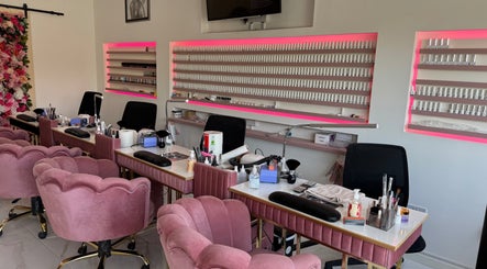 Elegant nail studio at Nikki D Nails Beauty Aesthetics, Chadwell St Mary, England, GB with plush pink chairs.