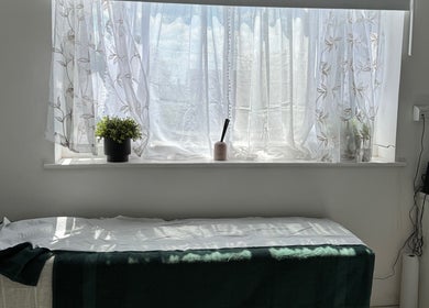 Relaxing treatment room at Nikki D Nails Beauty Aesthetics, Chadwell St Mary, England, GB with natural light.