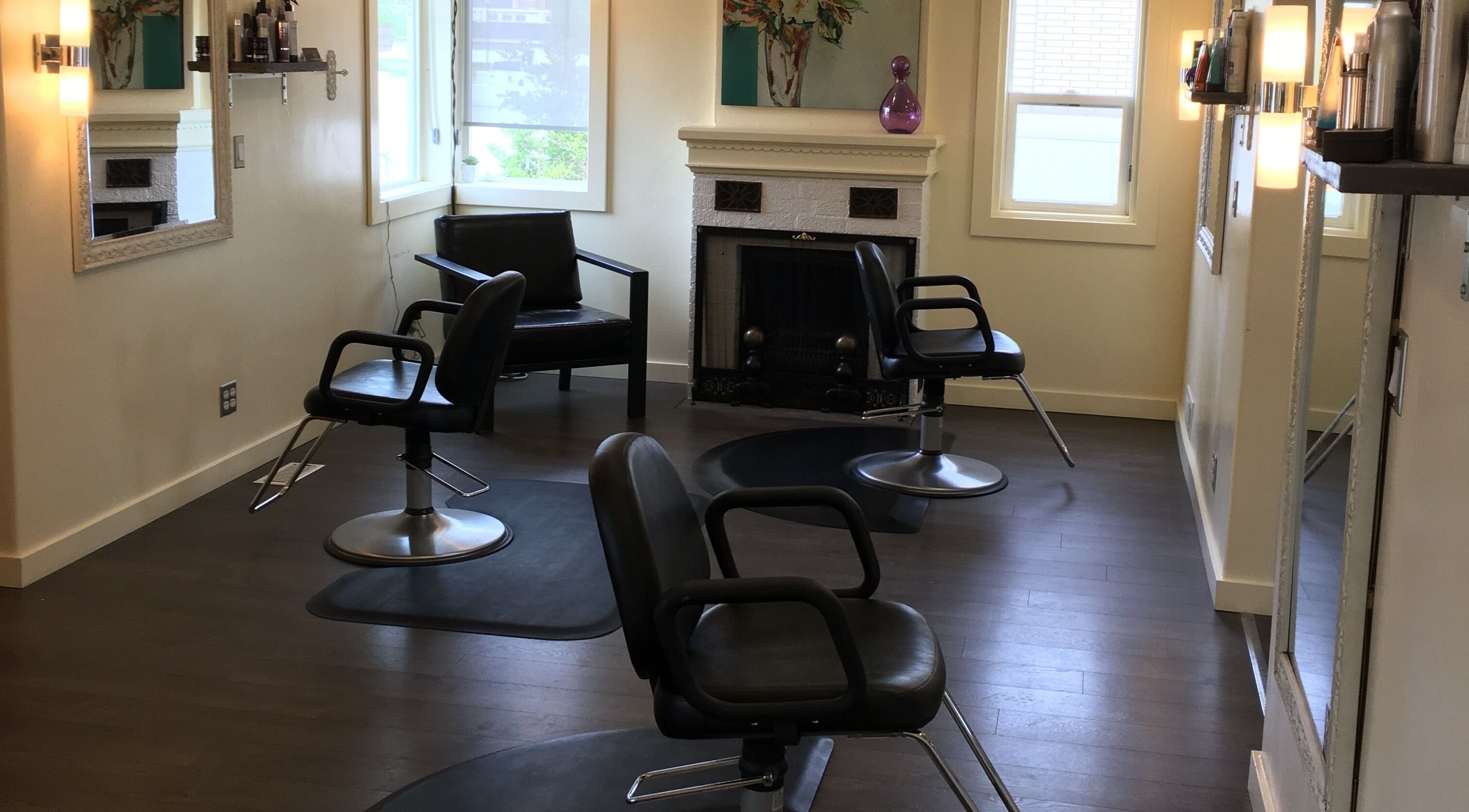 Stylish interior of Twisted Loxx Salon in Riverton, Utah, US, showcasing elegant salon chairs and mirrors.
