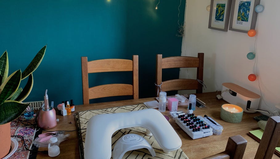 Nail care setup at Nails By Sohf, Manchester, England, GB featuring tools and vibrant polishes.