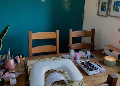 Nail care setup at Nails By Sohf, Manchester, England, GB featuring tools and vibrant polishes.