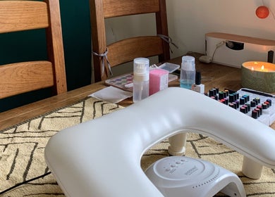 Nail care setup at Nails By Sohf with polishes and tools, Manchester, England, GB.