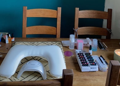 A serene nail salon setup at Nails By Sohf in Manchester, England, GB, showcasing tools and polishes.