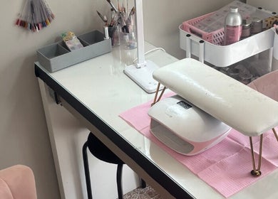 Modern nail workstation at Aries Nails, Hitchin, England, GB, equipped with tools for a relaxing spa experience.