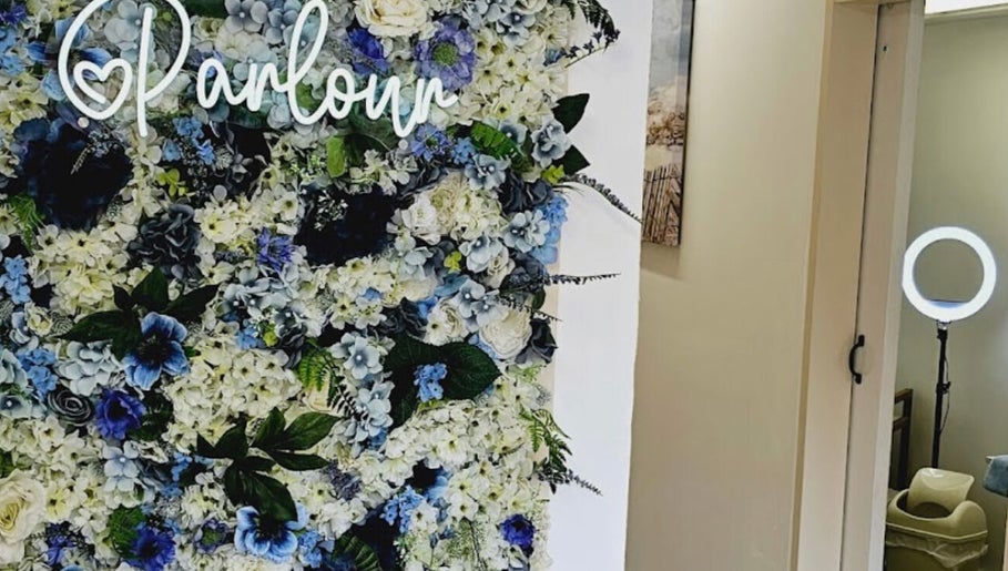 Pretty Parlour's floral wall adds beauty and charm to its location in Evesham, England, GB.