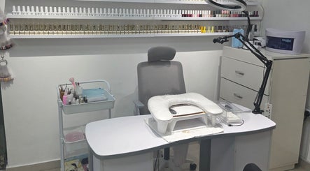 Elegant manicure station at Aljamal Almithali Beauty Salon in Ajman, Ajman, AE, showcasing nail polish variety.