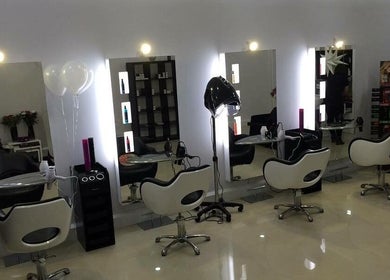Modern salon interior at Be You Tiful Hair And Beauty 01792 417957, Swansea, Wales, GB, featuring sleek styling chairs.