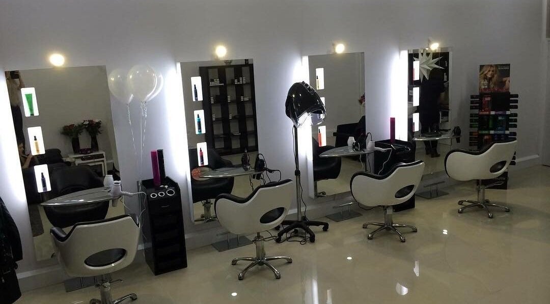 Modern salon interior at Be You Tiful Hair And Beauty 01792 417957, Swansea, Wales, GB, featuring sleek styling chairs.