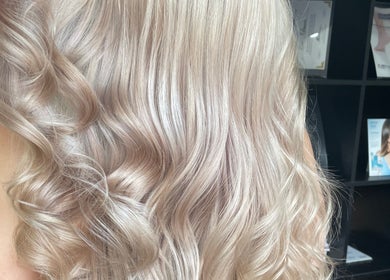 Elegant blonde curls styled at Be You Tiful Hair And Beauty 01792 417957, Swansea, Wales, GB.