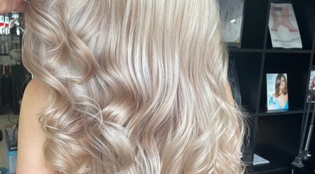 Elegant blonde curls styled at Be You Tiful Hair And Beauty 01792 417957, Swansea, Wales, GB.