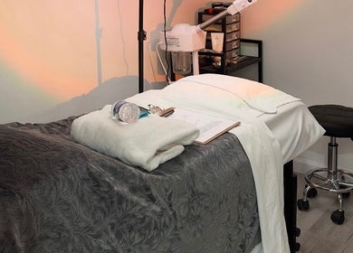 Relaxing massage table setup at Elite Esthetics by Dalal, Lodi, California, US. Cozy and inviting atmosphere.