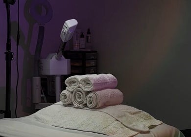 Cozy treatment room at Elite Esthetics by Dalal in Lodi, California, US, with spa towels and equipment.