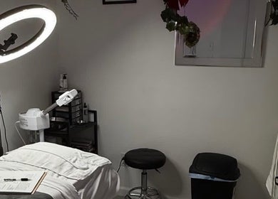 Spa treatment room at Elite Esthetics by Dalal, Lodi, California, US, featuring a massage bed and skincare tools.