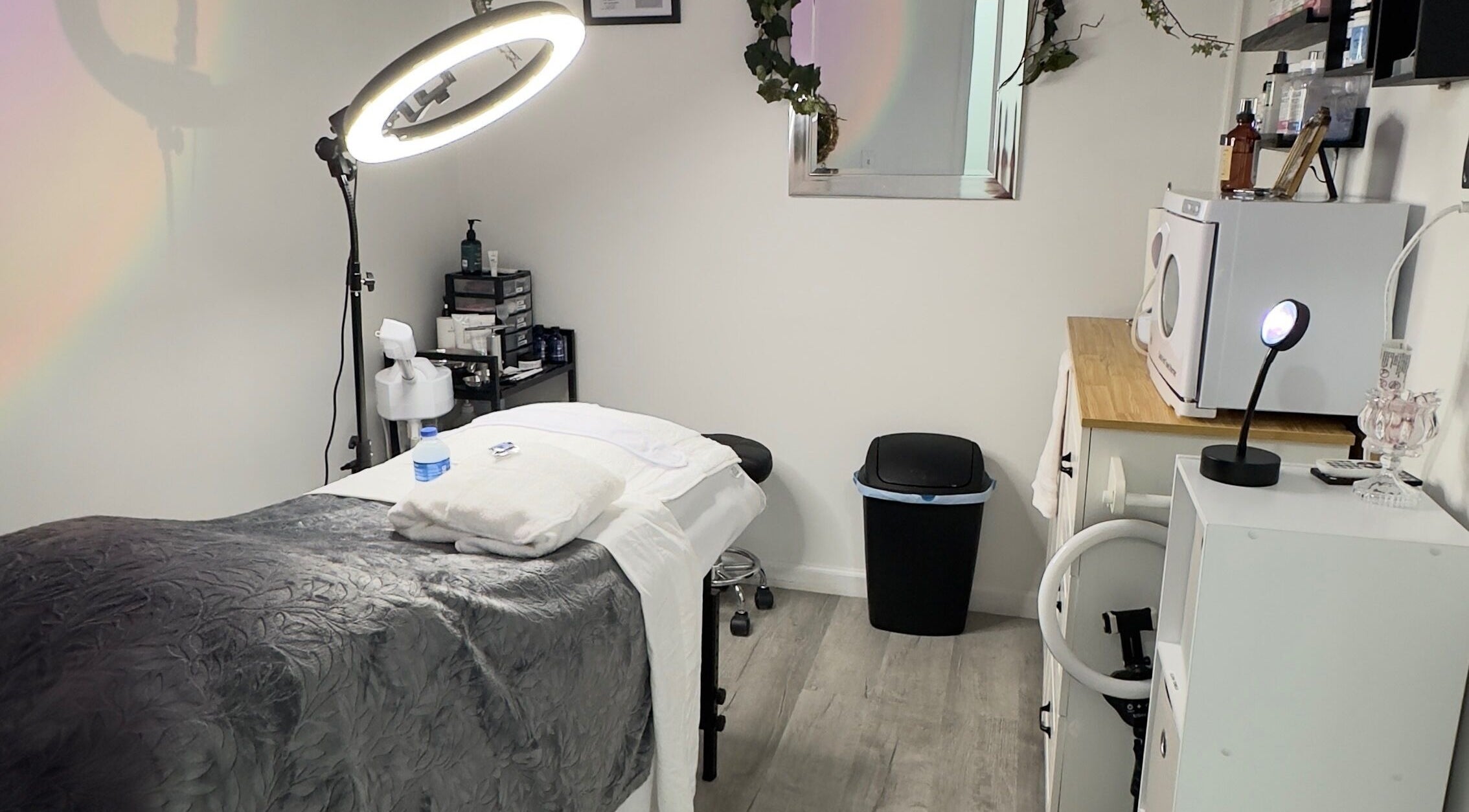 Elite Esthetics by Dalal spa room in Lodi, California, US with cozy massage table and soothing decor.
