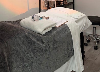 Cozy spa bed at Elite Esthetics by Dalal in Lodi, California, US, ready for a relaxing wellness session.