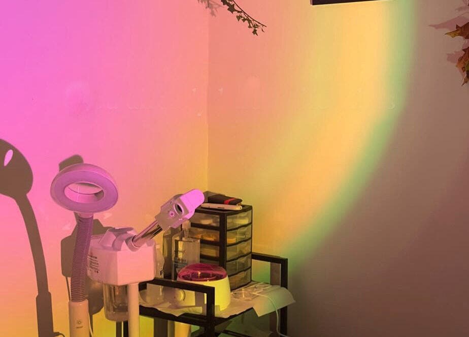 A well-lit corner at Elite Esthetics by Dalal, Lodi, California, US, featuring beauty equipment and colorful lighting.