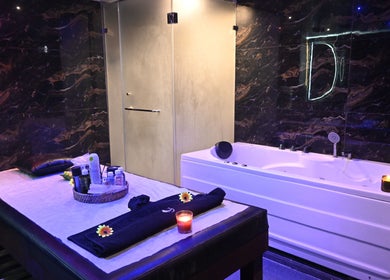 Luxurious treatment room at Refresh D Thai Spa, Bengaluru, Karnataka, IN, featuring elegant decor and spa amenities.