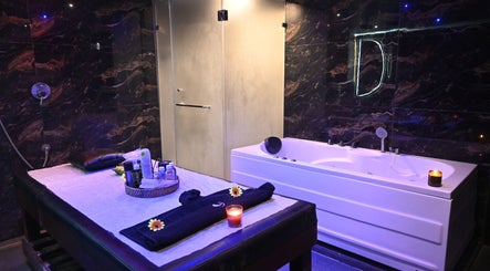 Luxurious treatment room at Refresh D Thai Spa, Bengaluru, Karnataka, IN, featuring elegant decor and spa amenities.