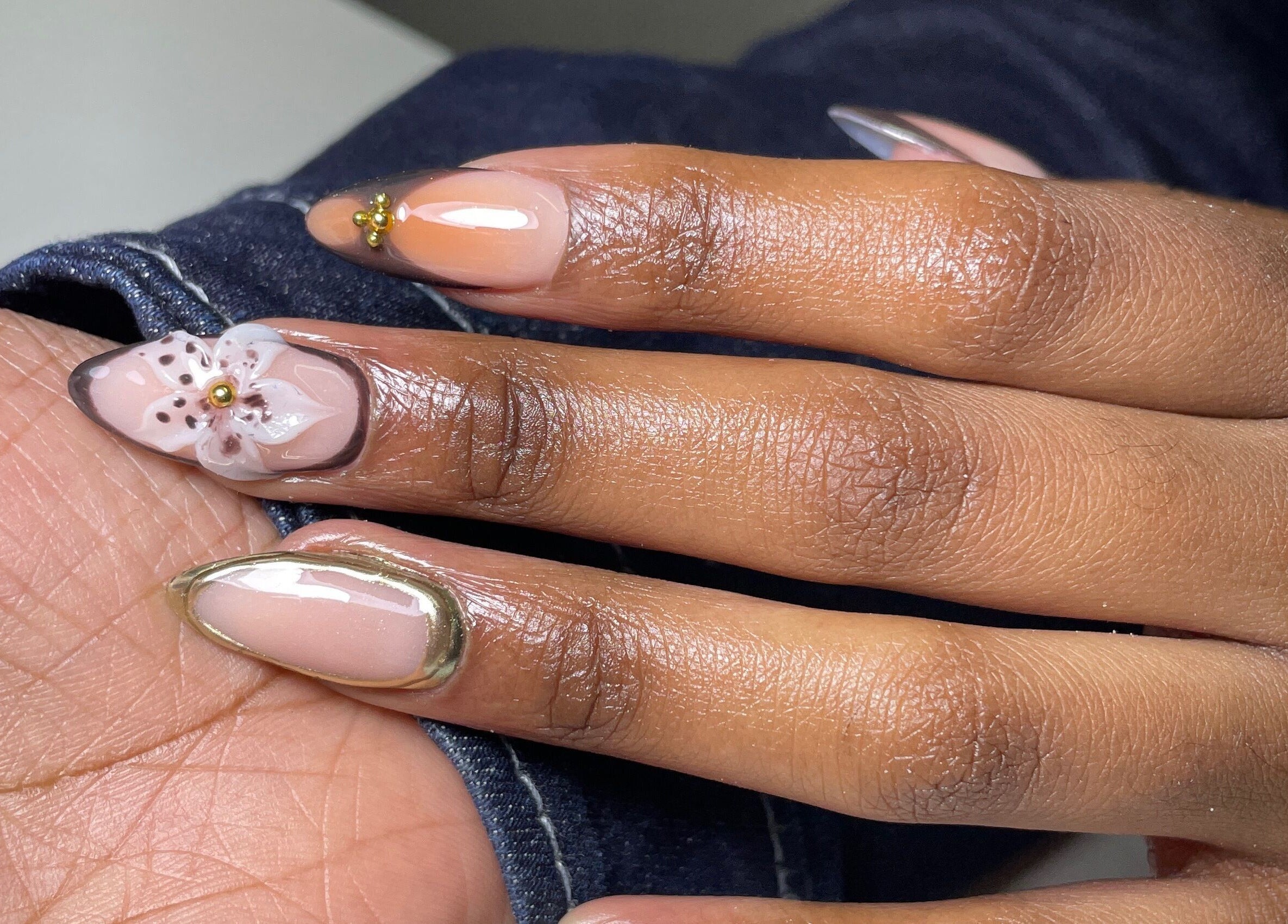 Beautiful floral nail art at Nailed By Ndasi in Gqeberha, Eastern Cape, ZA. Elegant manicure design.