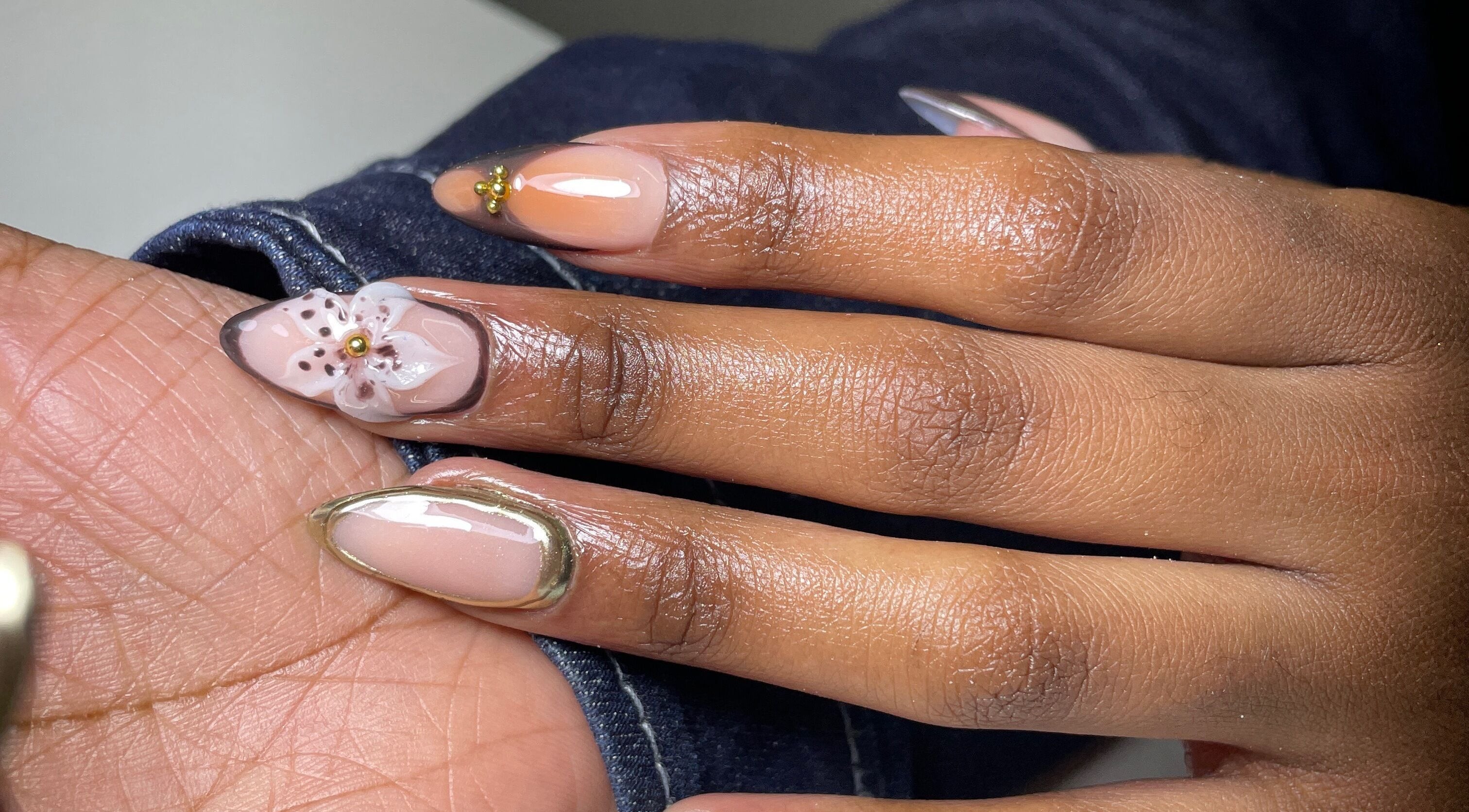 Beautiful floral nail art at Nailed By Ndasi in Gqeberha, Eastern Cape, ZA. Elegant manicure design.