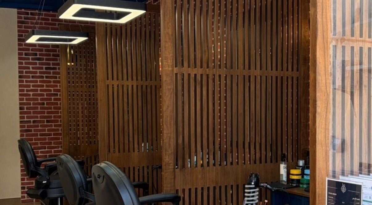 Stylish barber chairs at Dye Hard Barbers in Riyadh, Riyadh Province, SA, showcasing a modern barber setup.