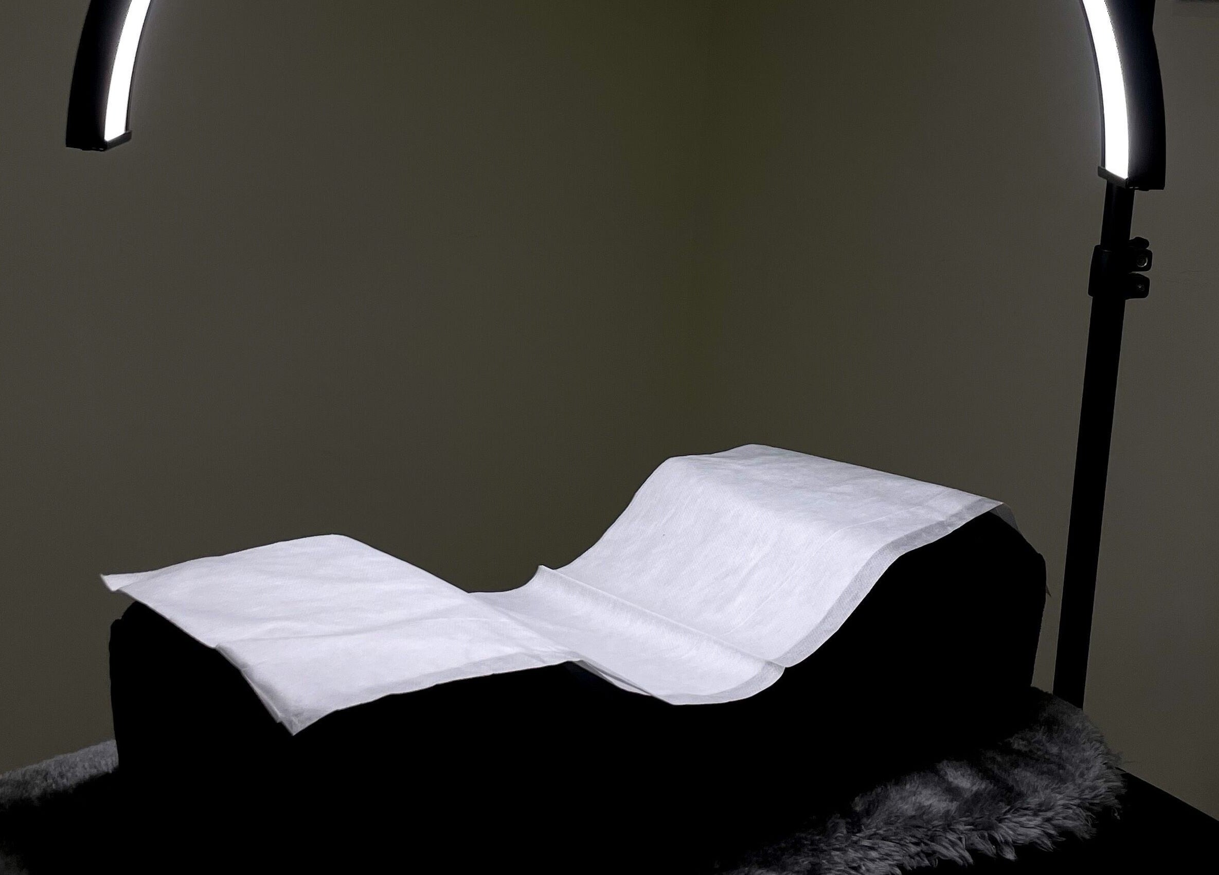 Cozy massage bed with overhead lighting at Sarlash KL, Kuala Lumpur, Wilayah Persekutuan Kuala Lumpur, MY.