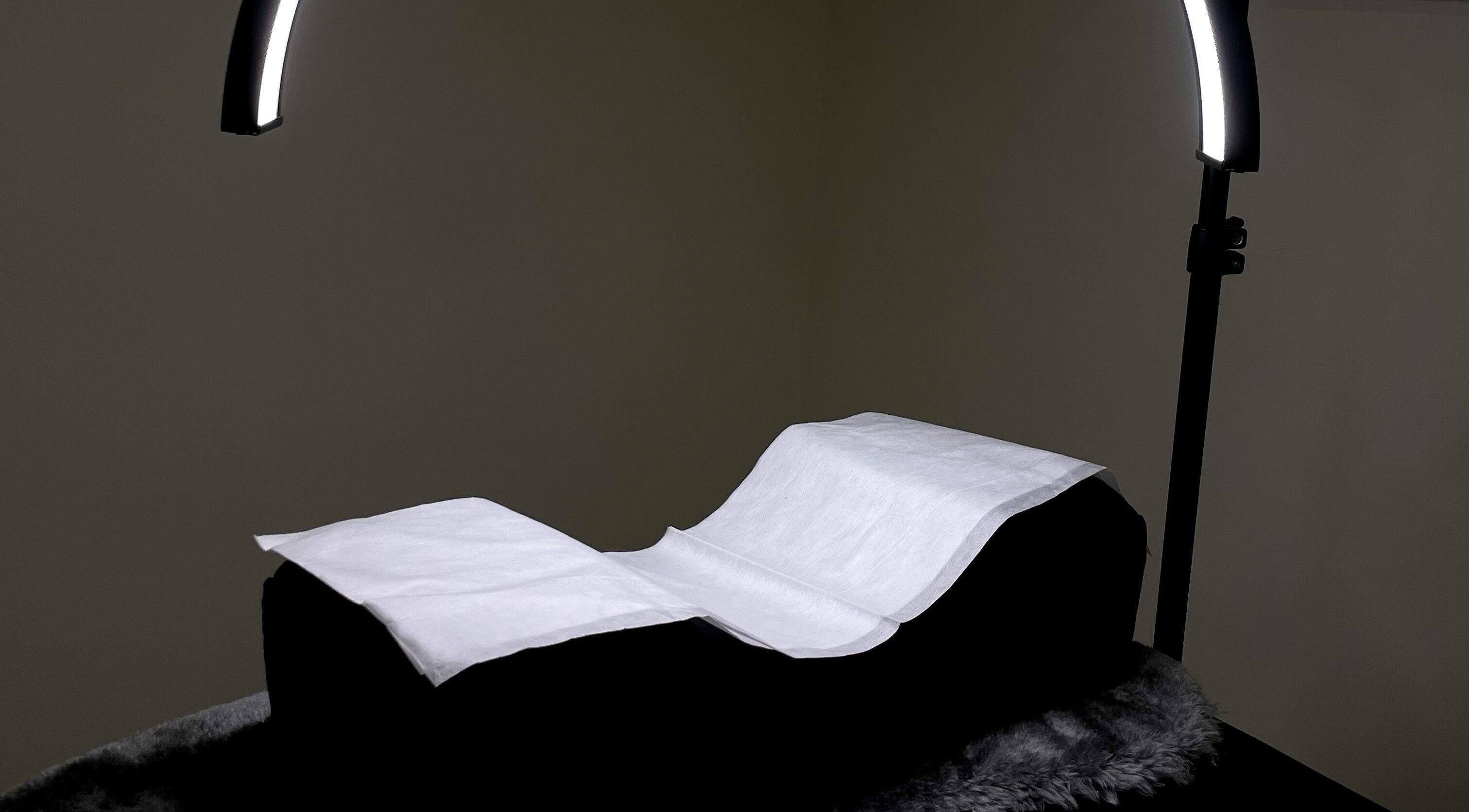 Cozy massage bed with overhead lighting at Sarlash KL, Kuala Lumpur, Wilayah Persekutuan Kuala Lumpur, MY.