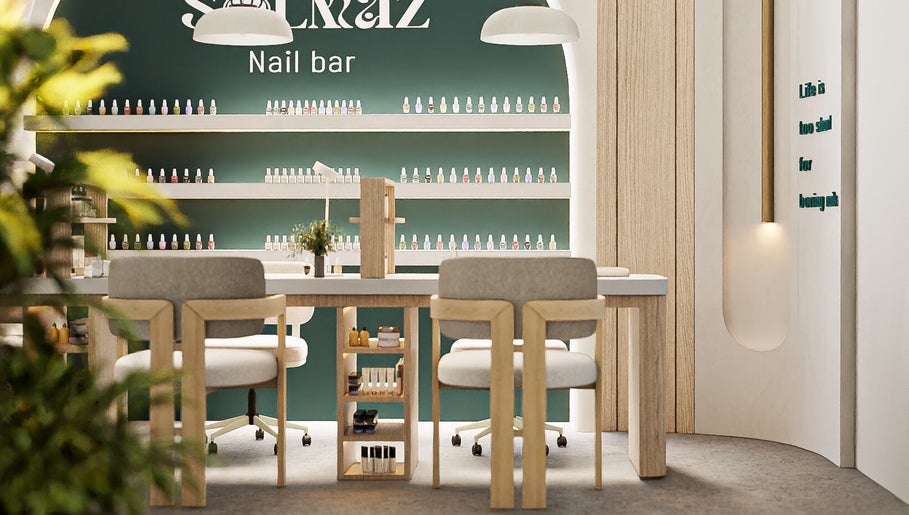 Solmaz spa and beauty center's elegant nail bar in Seeb, Muscat Governorate, OM with modern decor and nail polish display.