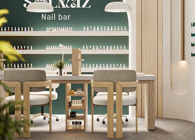 Solmaz spa and beauty center's elegant nail bar in Seeb, Muscat Governorate, OM with modern decor and nail polish display.