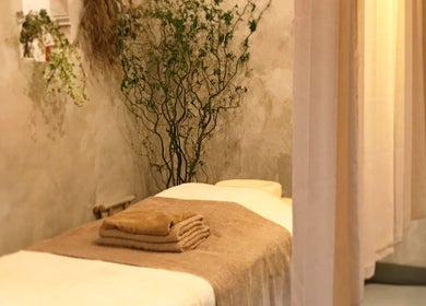 Tranquil massage room at Kea Forest, Korora, New South Wales, AU with inviting decor and plush towels.