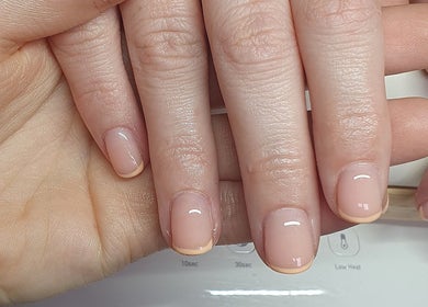 Close-up of a fresh manicure at Gel Ave., Melbourne, Victoria, AU showcasing natural, glossy nails.