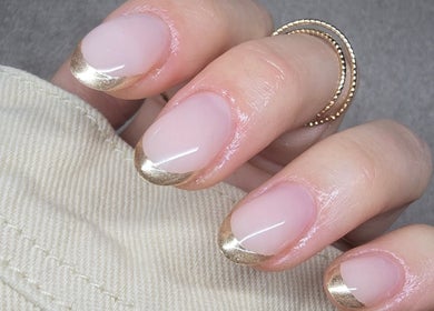 Elegant gold-tipped manicure at Gel Ave., Highett, Victoria, AU, showcasing chic nail art design.