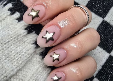 Close-up of star-adorned nails at Gel Ave., Highett, Victoria, AU.
