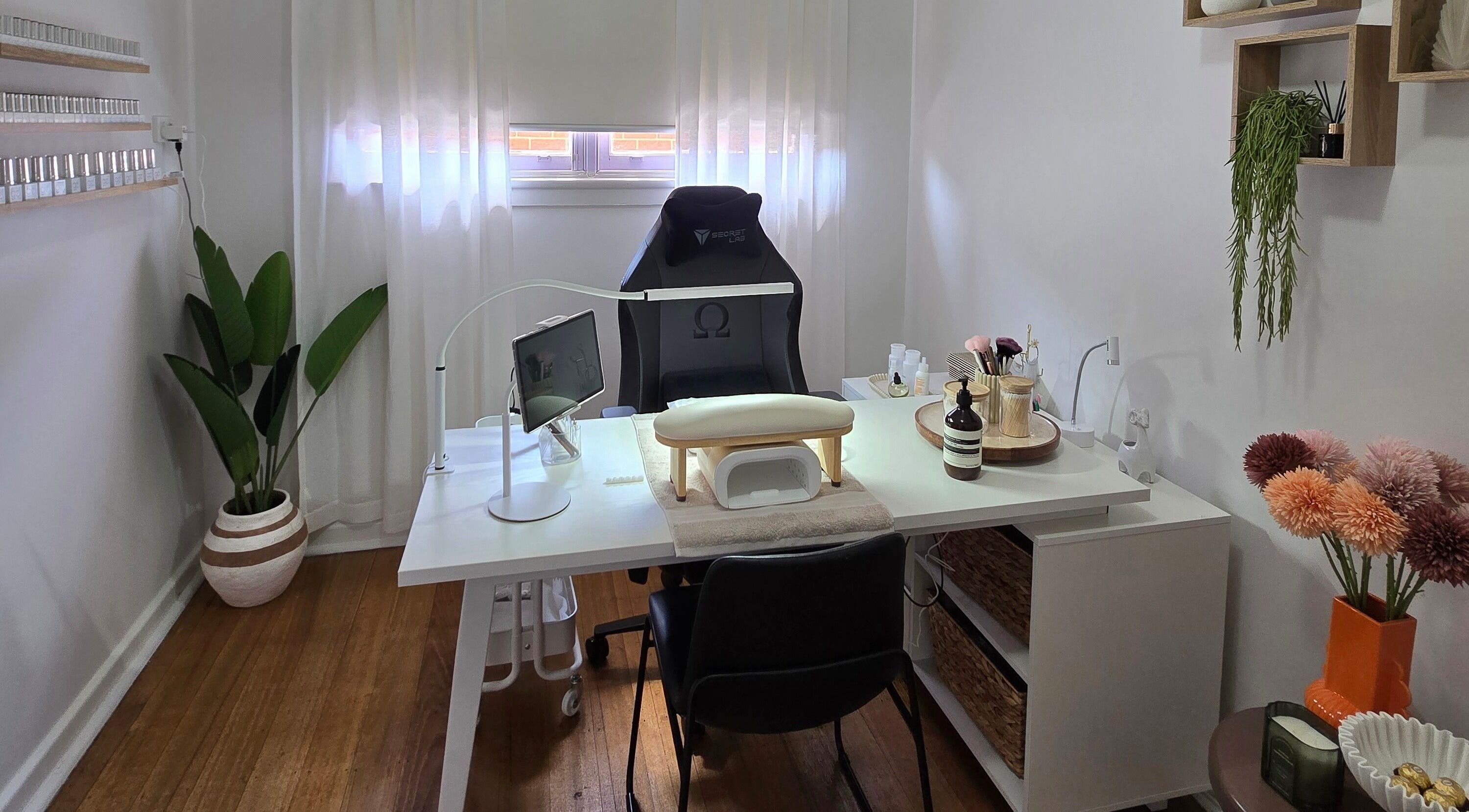 Elegant nail salon desk at Gel Ave., Highett, Victoria, AU with cozy decor and lush plants.