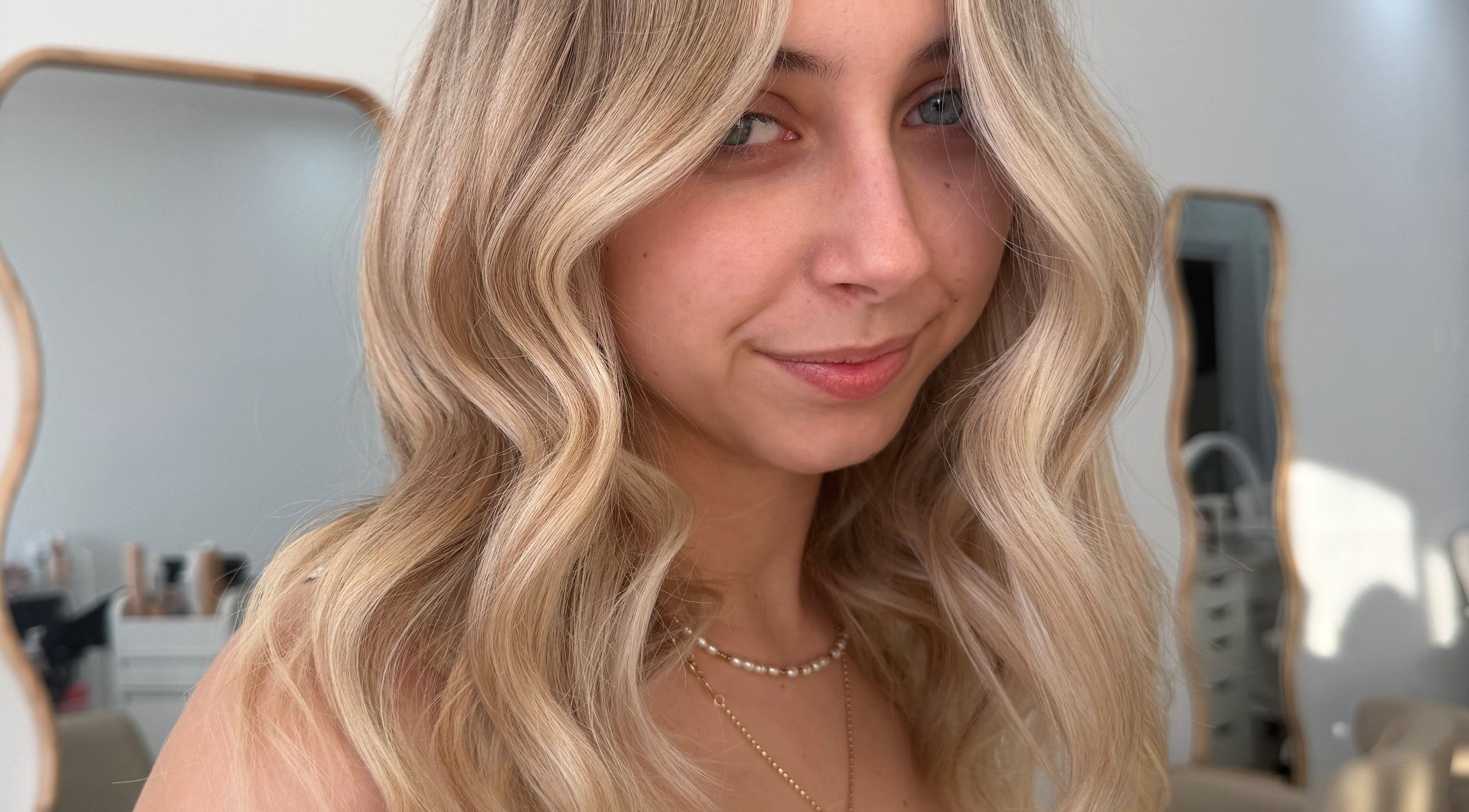 Elegant blonde waves styled at Heavenly Strands, Glen Alpine, New South Wales, AU salon. Perfect hair transformation.