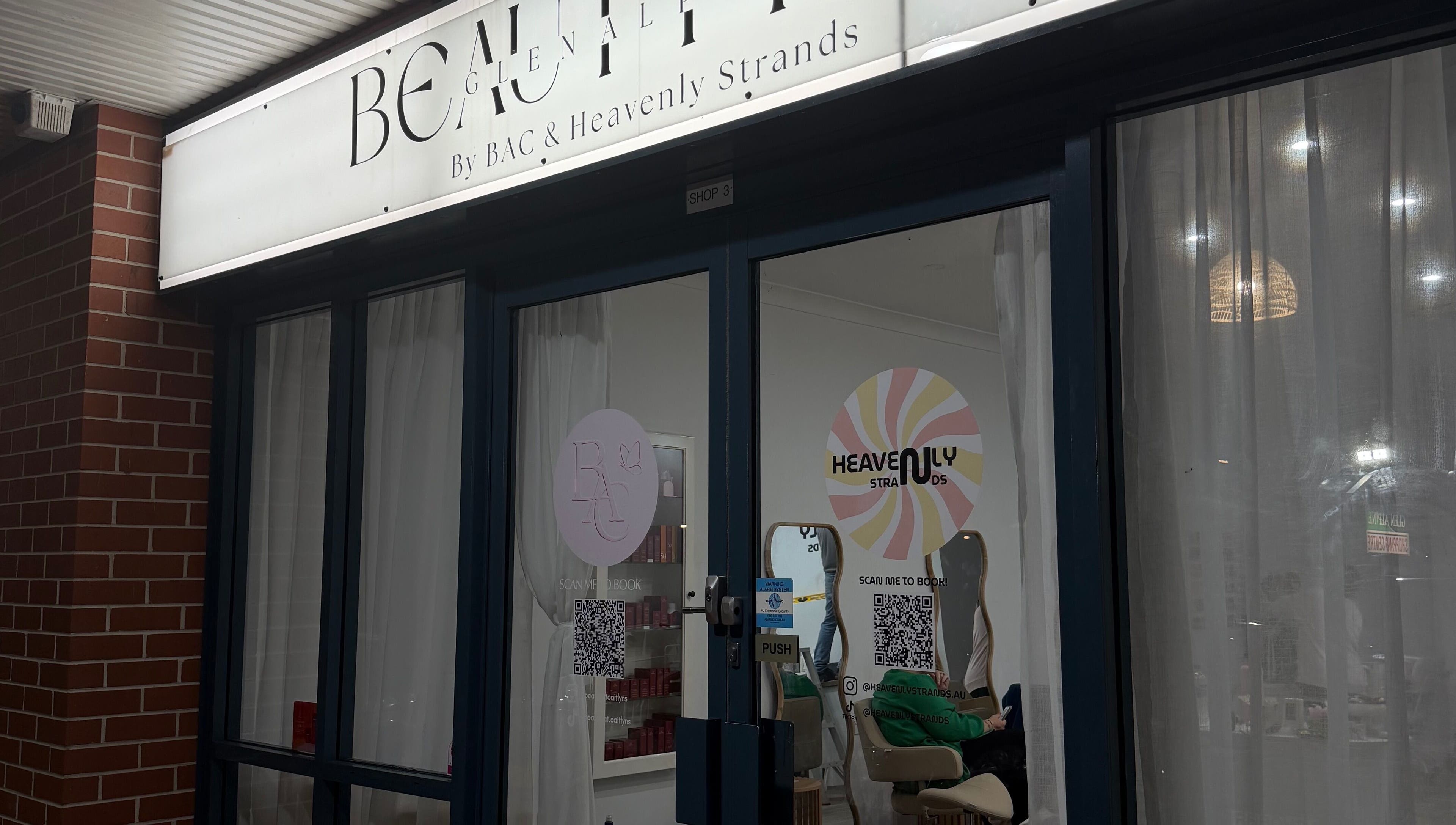 Entrance of Heavenly Strands salon in Glen Alpine, New South Wales, AU with elegant signage.
