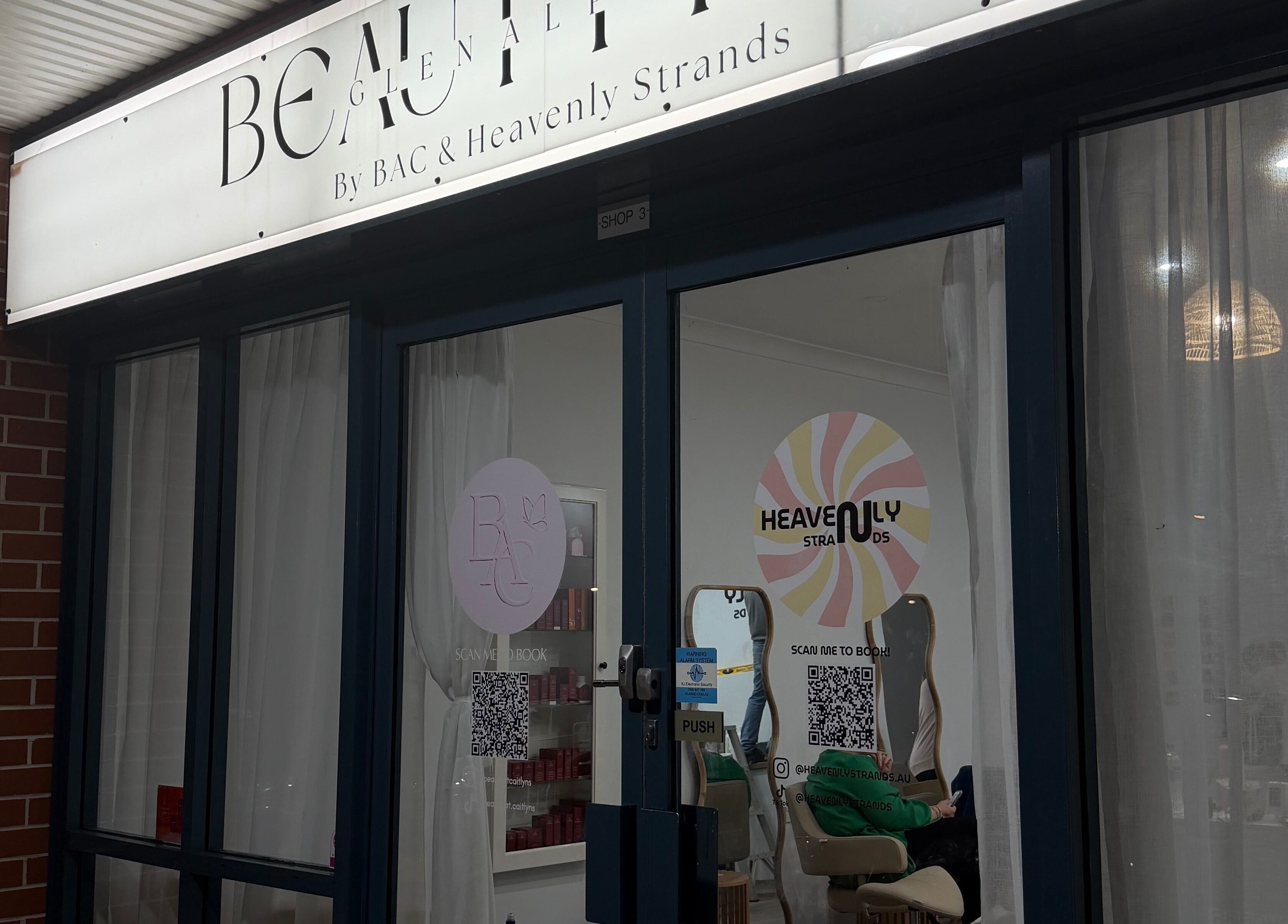 Entrance of Heavenly Strands salon in Glen Alpine, New South Wales, AU with elegant signage.